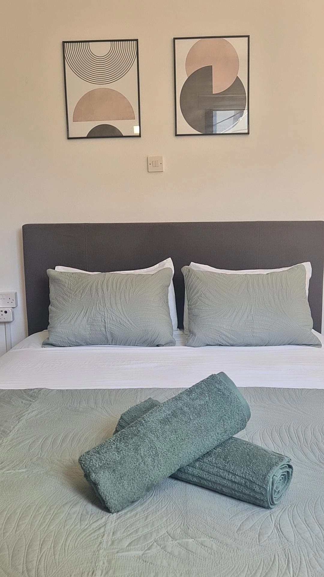 Nostos double bedroom prepared with fresh towels